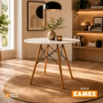 Mesa redonda Eames con estructura moderna y patas en madera para espacios contemporáneos.