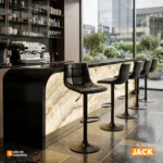 El butaco Jack con monoconcha tapizada en cuero sintético, base giratoria y reposapiés metálico regulable en altura.